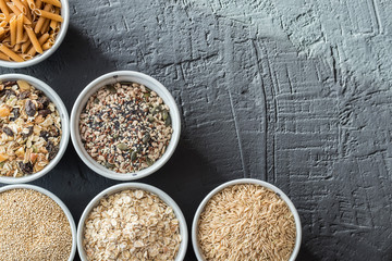 Bowls with whole grain carbohydrates, oats, brown rice, seeds, quinoa and whole grain pasta. Whole grain cereals