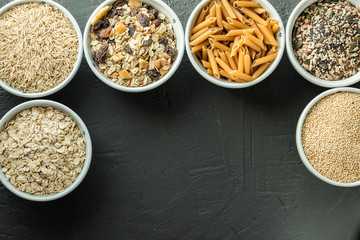 Bowls with whole grain carbohydrates, oats, brown rice, seeds, quinoa and whole grain pasta. Whole grain cereals