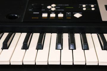A photo of old used synthesizer, electronic musical keyboard. Keyboard or piano for digital music...