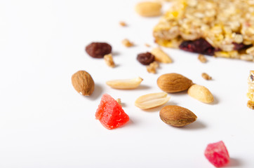 Mix of nuts, dried fruits, raisins on white background