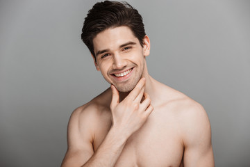 Beauty portrait of half naked laughing young man