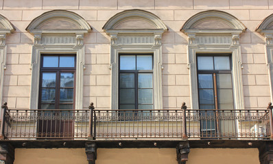 Building Facade with Cozy Balcony of Old Historic House. Classic Old Town European Style Architecture of Small Balcony with Two Doors and Window in the Middle in Saint Petersburg, Russia.