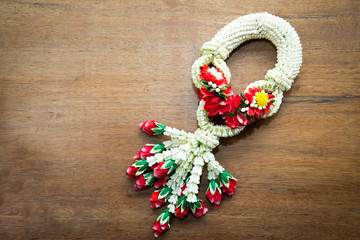 Thai traditional jasmine garland on wood background