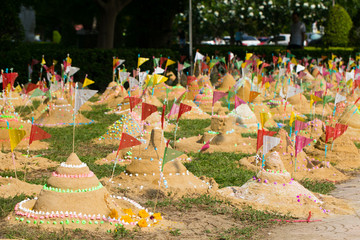 Many of paper flag put in a heap of sand to celebrate a temple Songkran Festival in Thailand