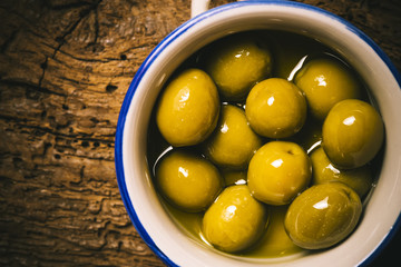 Appetizing green salted olives