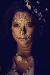 Girl with a stylized make-up of a dead bride