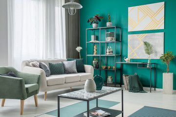 Bright sofa in green room © Photographee.eu