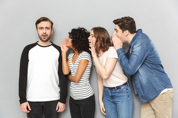 Group of friends tell secrets talking with each other.