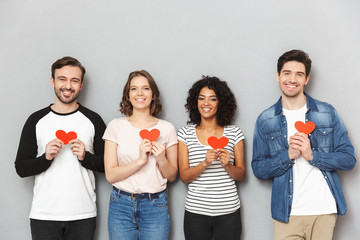 Happy loving couples friends holding hearts.