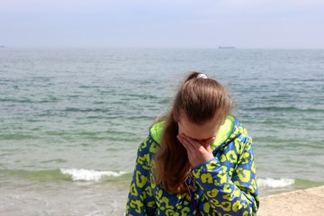 Sad girl on a beach