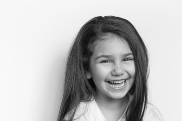 Portrait of happy child girl. Black and white portrait.