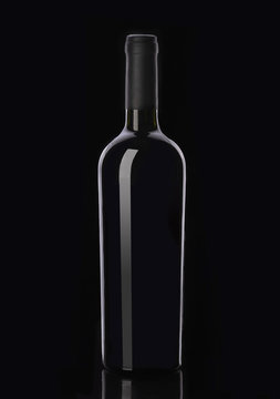 Bottle of red wine on black background