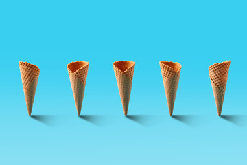 Ice cream cones pattern. Turquoise background. Sweet, summer and empty concept.