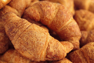 Background of fresh croissants.