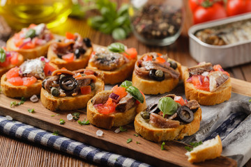 Mix Bruschetta with sardines and anchovies.