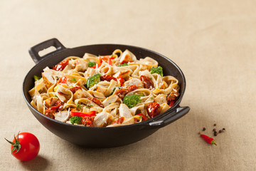 Whole-grain tagliatelle pasta with grilled chicken.