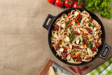 Whole-grain tagliatelle pasta with grilled chicken.