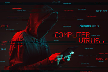 Computer virus concept with faceless hooded male person