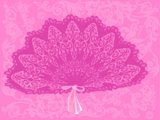 decorated fan on pink background
