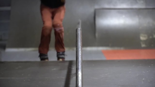 Montage shooting as a man with dreadlocks roller-skating in a skate park, slow motion