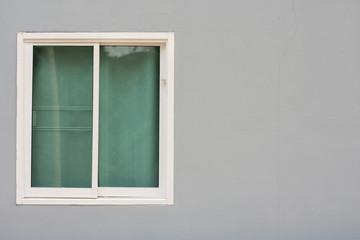 Glass window sliding on gray
wall interior house.
