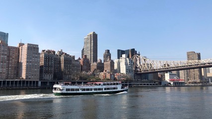 New York City, USA - April 2018: Cruising on boat along the East River and Manhattan