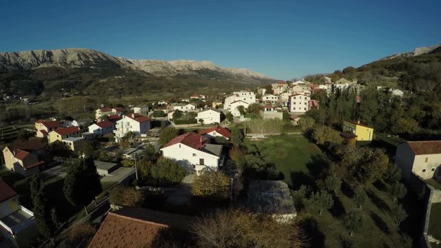 Buildings and mountains in Baska town, aeria