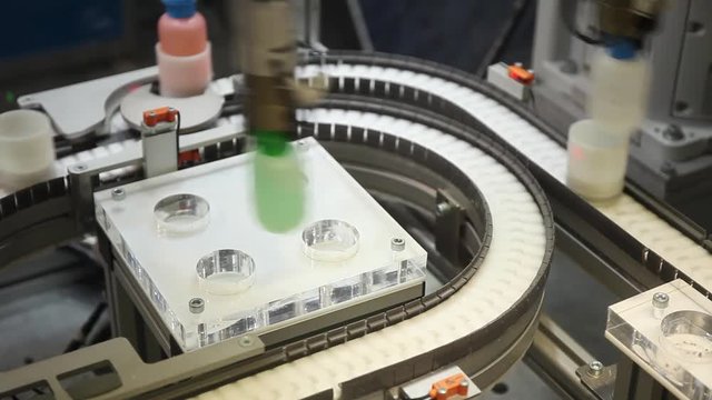 Automated conveyor and robot hand manipulator.