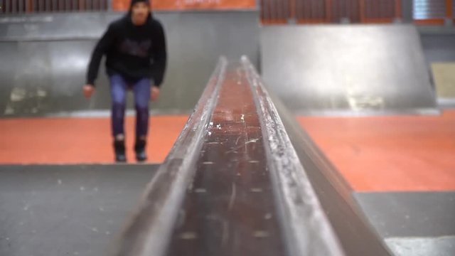 The guy on the rollers performs grind cheese grater on the camera, slow motion. Niffty