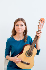 Fototapeta premium Woman playing a guitar
