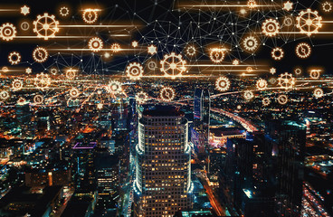 Gears with Downtown Los Angeles at night