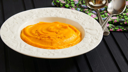 pumpkin soup puree in the white plate