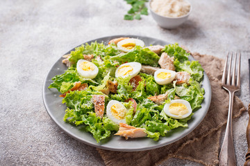 Caesar salad with eggs, chicken and parmesan