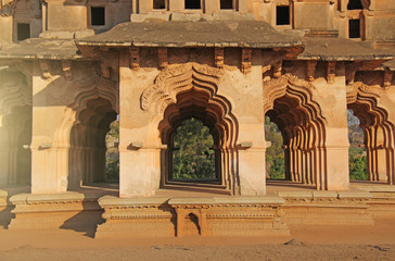 Lotus Mahal Temple in Hampi, Karnataka, India. Beautiful carved stone arch and sunset. A popular...