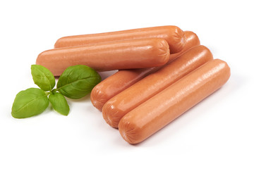 Boiled sausages with basil, isolated on white background.