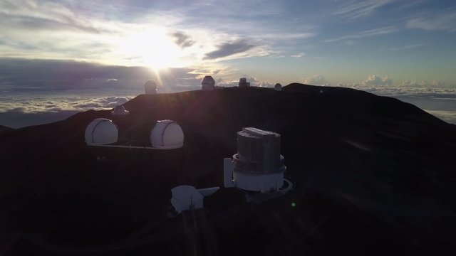 Sunrise at the Telescopes of Mauna Kea Astronomical Observatory, Hawaii. USA