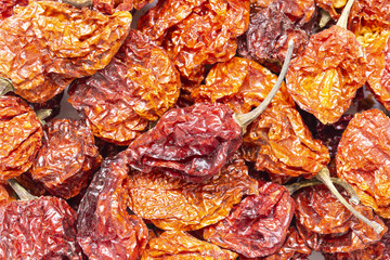dried carolina reaper peppers background