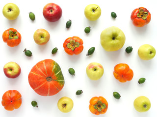 Autumn concept. Pumpkin, grapes,persimmon, red and green apples on a white background. Pattern of fresh vegetables. Top view, flat lay. composition of fresh vegetables and fruits.