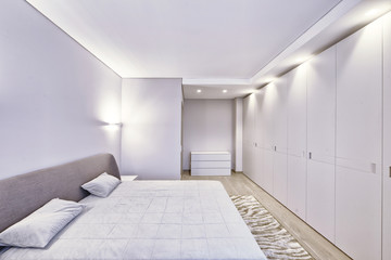 Fototapeta na wymiar Modern interior of a bedroom in the new house.