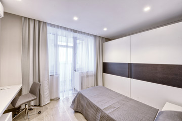 Modern interior of a bedroom in the new house.