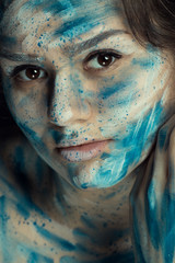 portrait of a girl with paints on her face