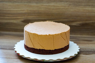 Chocolate cake with mousse and ice cream on a stand