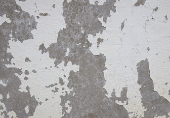 old cracked paint on the concrete wall