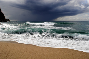 Big waves crushing on curved stone, on stormy weather, big tide. Alanya, Turkey.