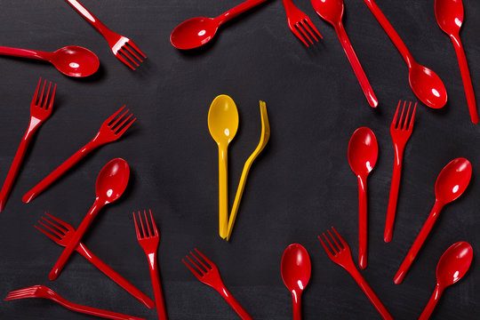 Lunch time background with colorful disposable cutlery