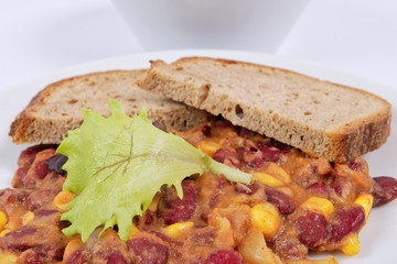 Cowboy beans with bread on a table
