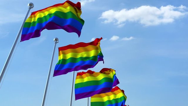 Waving LGBT pride flags against the sky, loopable 3D animation