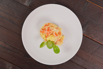 Cream potatoes with vegetables on a table