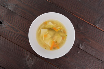 Noodle soup with vegetables on a table