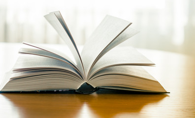 book with open pages on the table